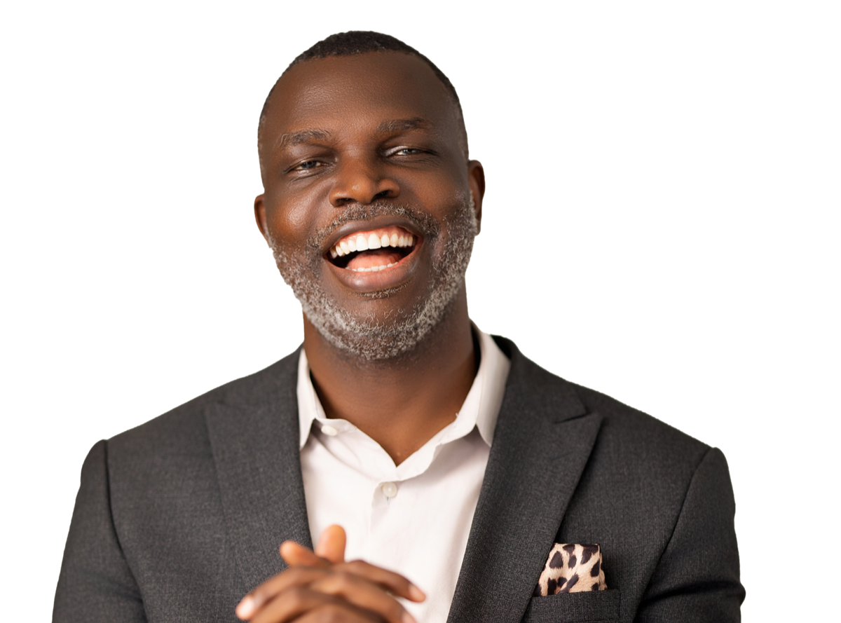 Dr Solomon Kpandei smiling, wearing a dark suit